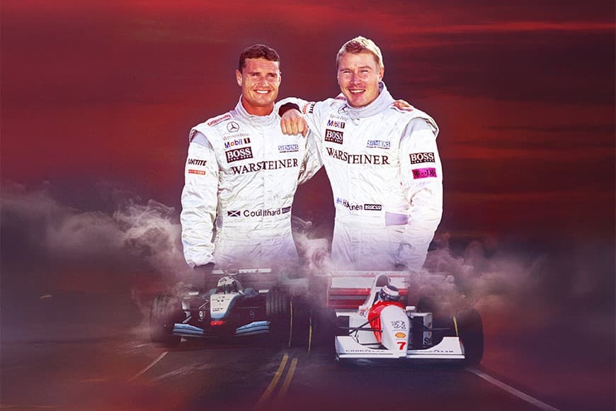 David and Mika smiling wearing racing gear