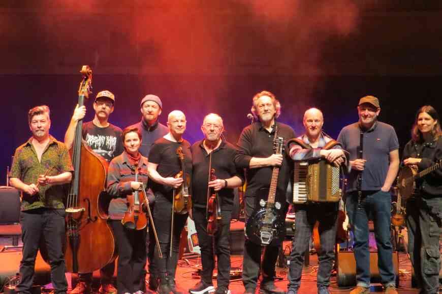 Group photo of previous Transatlantic Session performers on stage.